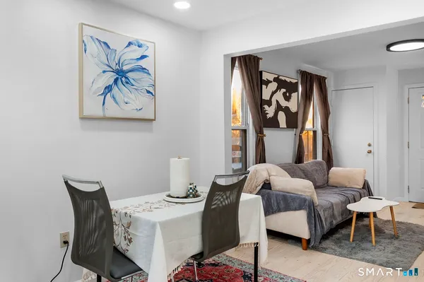 a bedroom with a bed and a table