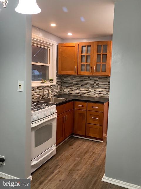 128 Margate Road Upper Darby, PA 19082 - Photo 4 of 12 a kitchen with stainless steel appliances granite countertop a stove and a sink