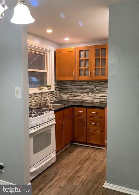 128 Margate Road Upper Darby, PA 19082 - Photo 5 of 12 a kitchen with stainless steel appliances granite countertop a stove and a sink