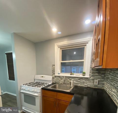 128 Margate Road Upper Darby, PA 19082 - Photo 6 of 12 a kitchen with stainless steel appliances granite countertop a stove and a sink