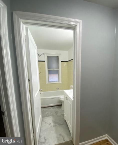 128 Margate Road Upper Darby, PA 19082 - Photo 8 of 12 a bathroom with a vanity and a bathtub