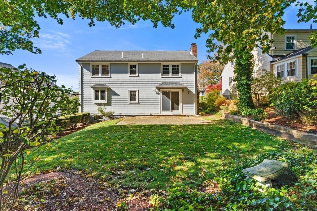 68 Lovell Road Watertown, MA 02472 - Photo 27 of 31 a front view of a house with a yard