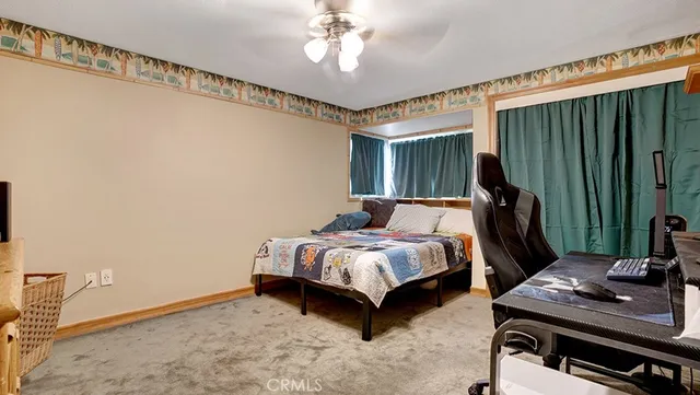 a bedroom with bed and a window