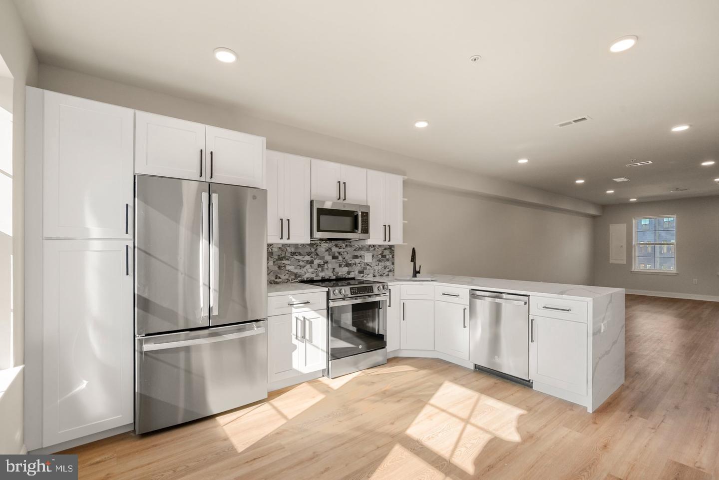 2709 Priya, Unit A76 Philadelphia, PA 19131 - Photo 3 of 29 Modern kitchen with sleek finishes.