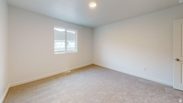 777 Pheasantbrook Drive, Unit 2B Centerville, UT 84014 - Photo 22 of 42 Neutral-toned carpeting spans the room, complemented by white walls and trim