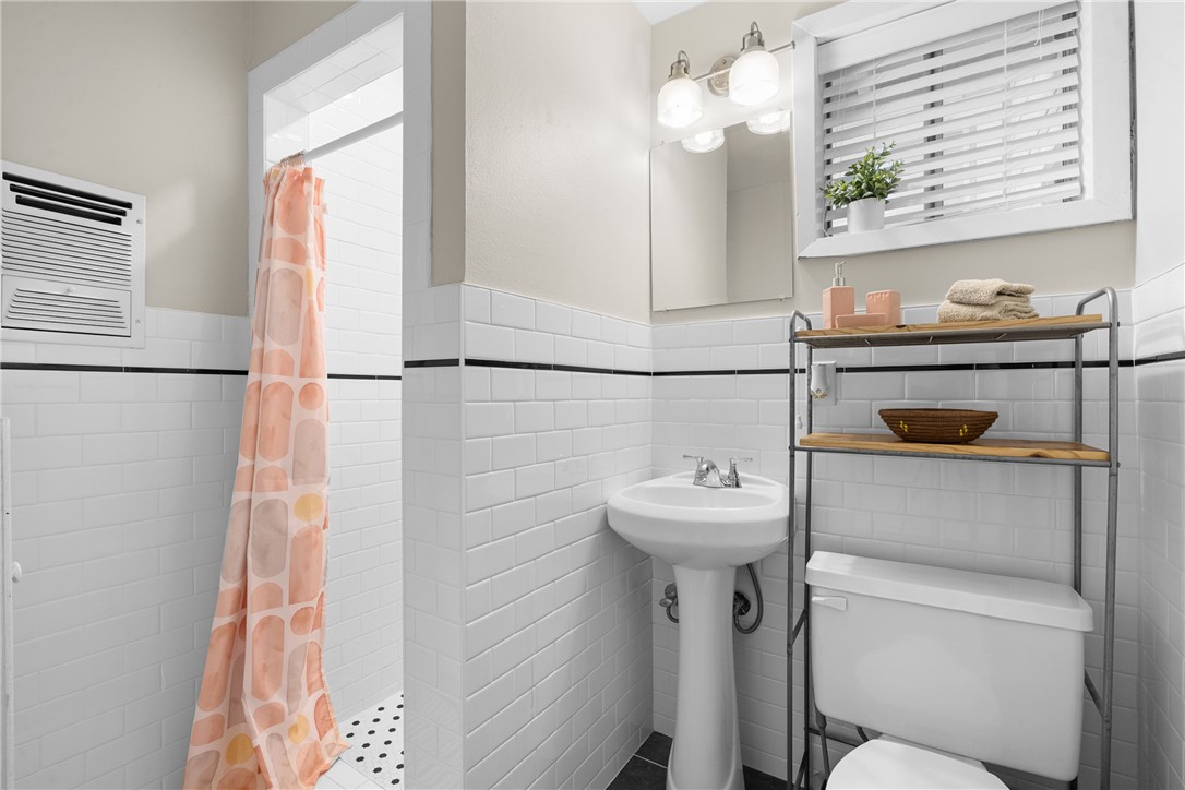 909 Enfield Street Bryan, TX 77802 - Photo 32 of 45 Recently remodeled primary bathroom.