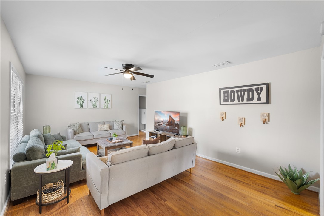 909 Enfield Street Bryan, TX 77802 - Photo 4 of 45 Bright living room space with natural wood floors.