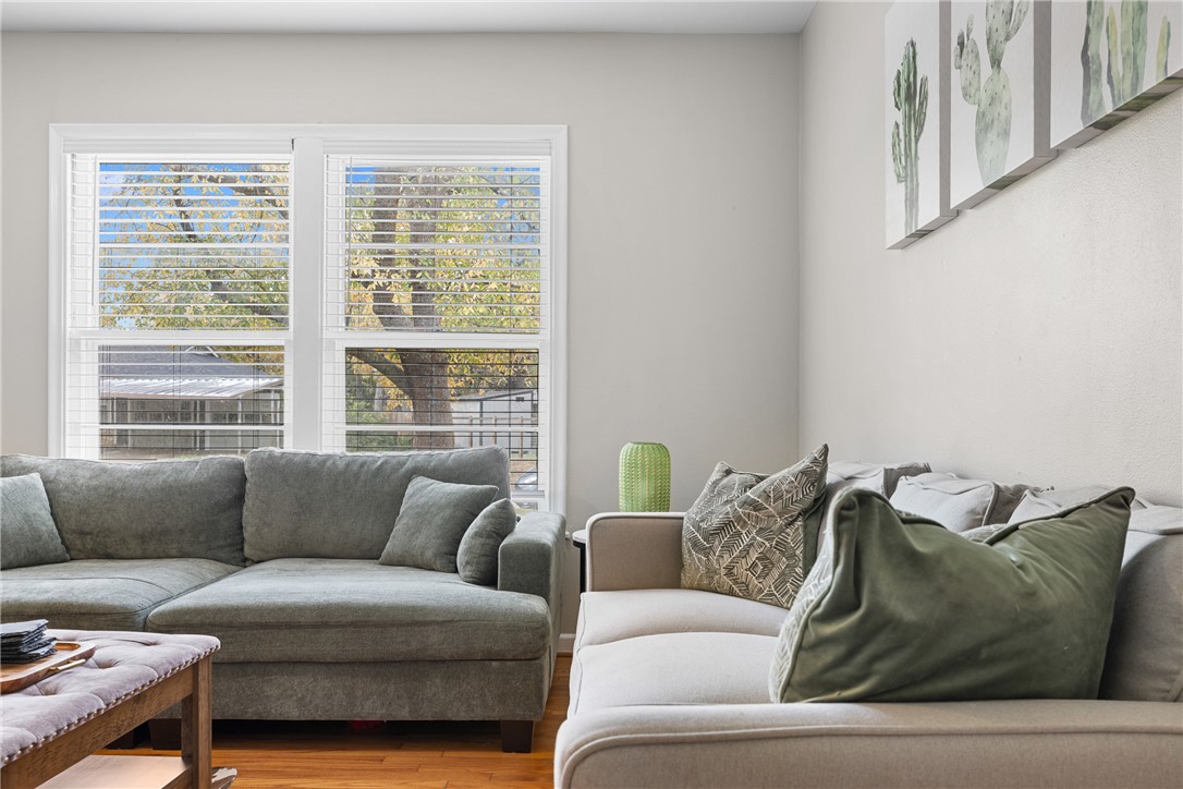 909 Enfield Street Bryan, TX 77802 - Photo 5 of 45 Bright living room space with natural wood floors.