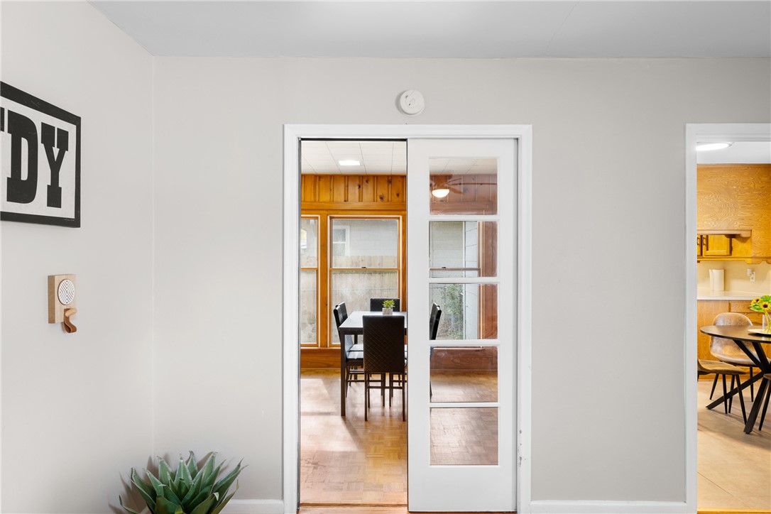 909 Enfield Street Bryan, TX 77802 - Photo 7 of 45 Original pocket doors from living room to large sun / bonus room.