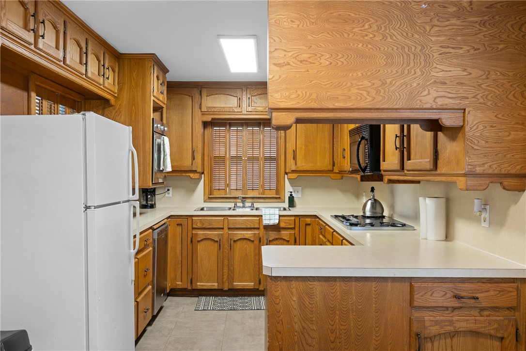 909 Enfield Street Bryan, TX 77802 - Photo 10 of 45 Warm wood cabinets with plenty of counter space.