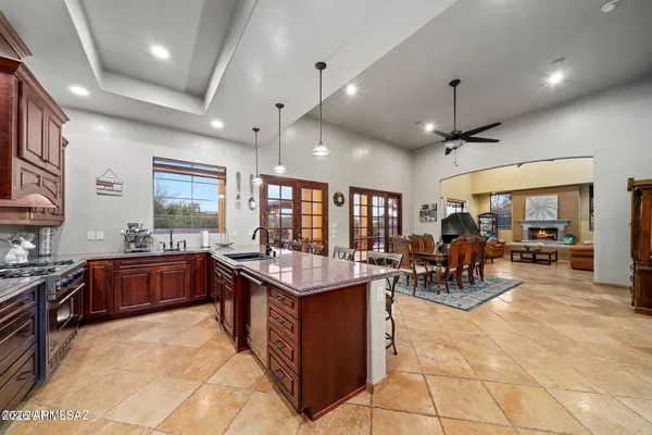 a large kitchen with a table and chairs