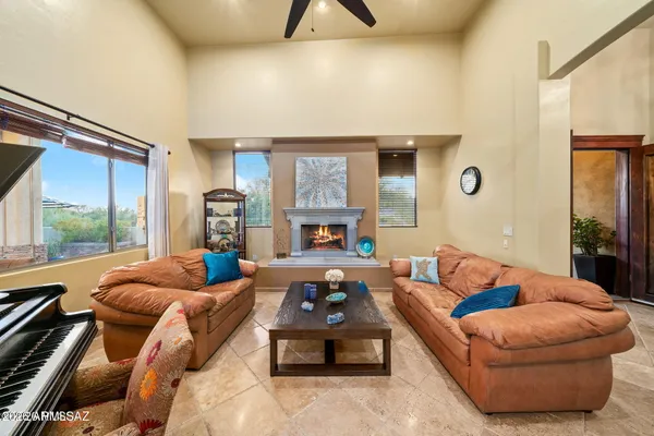 a living room with lots of furniture and a large window