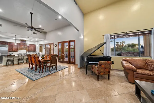 a living room with furniture and kitchen view