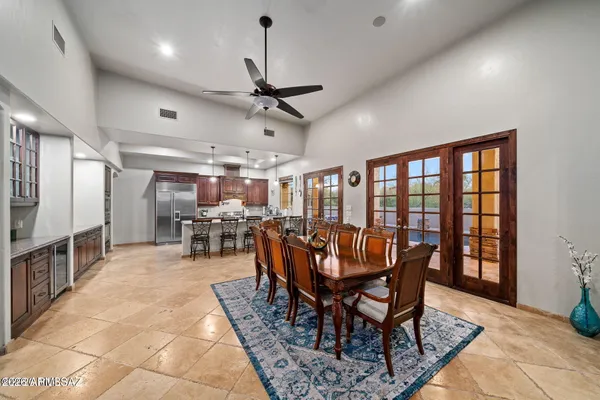 a large kitchen with lots of counter space and furniture