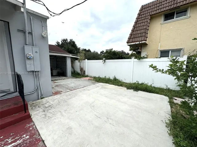 a view of a backyard of the house