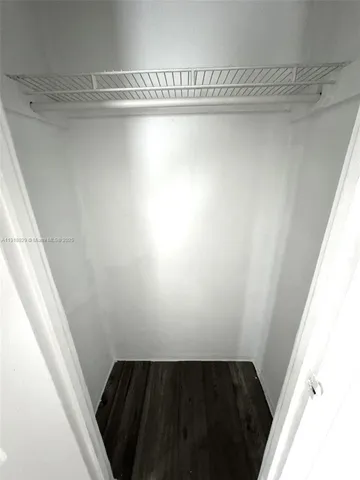 a view of a closet in a bathroom
