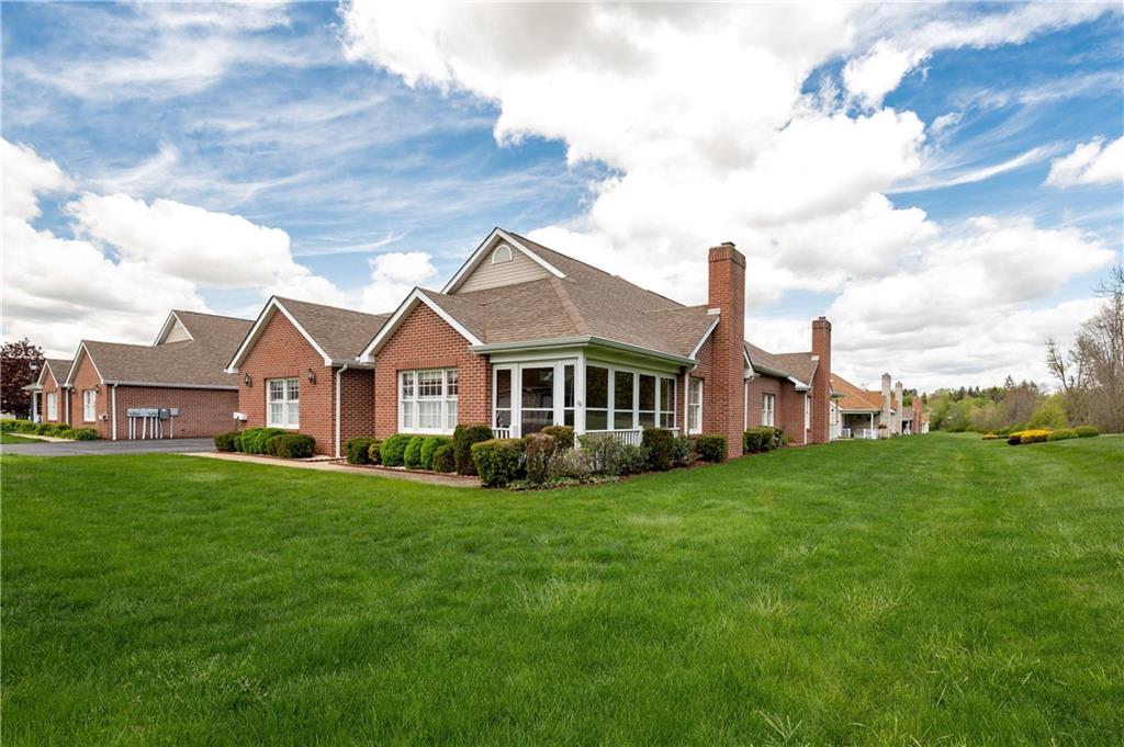 192 Wood Hawk Lane Butler, PA 16001 - Photo 2 of 23 a front view of a house with a garden