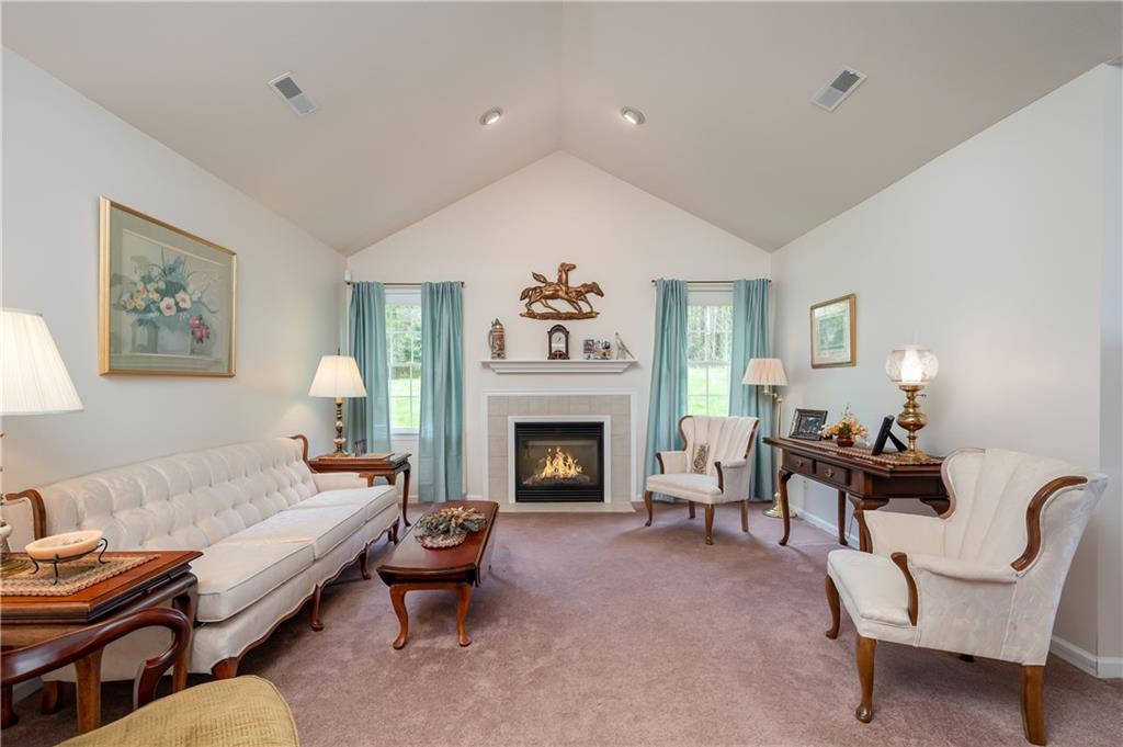 192 Wood Hawk Lane Butler, PA 16001 - Photo 11 of 23 a living room with furniture and a fireplace