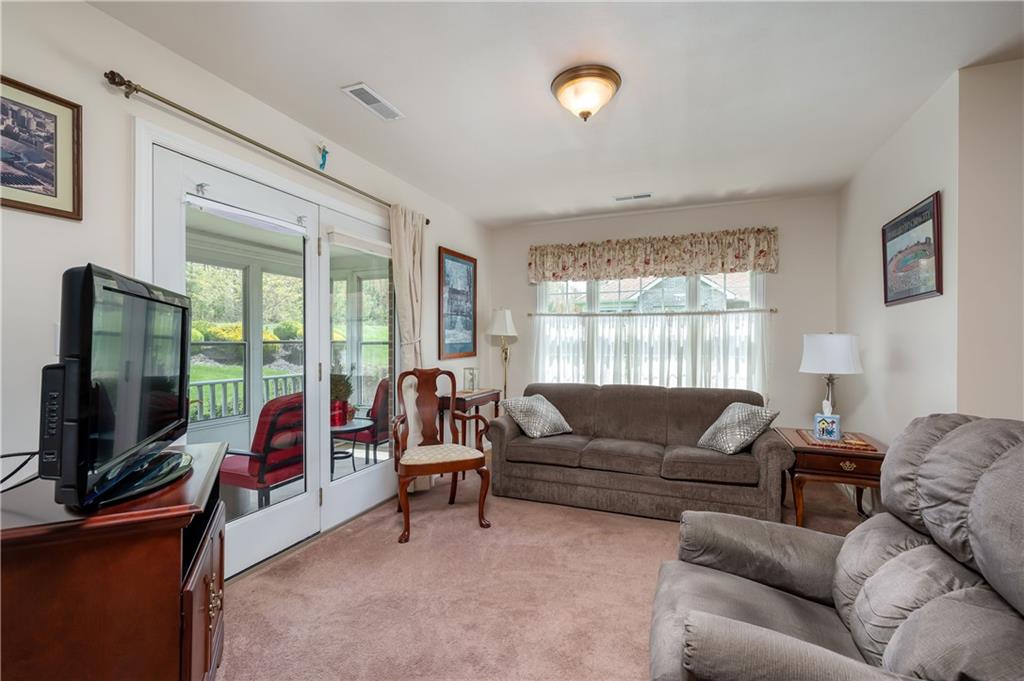 192 Wood Hawk Lane Butler, PA 16001 - Photo 12 of 23 a living room with furniture and a flat screen tv