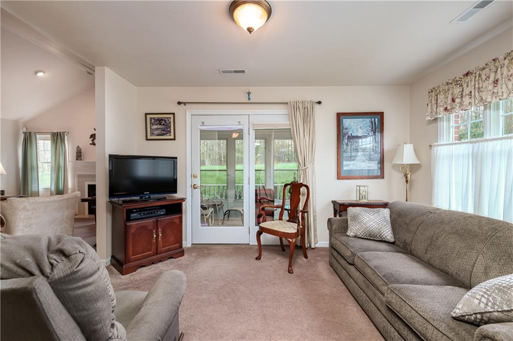 192 Wood Hawk Lane Butler, PA 16001 - Photo 13 of 23 a living room with furniture and a flat screen tv