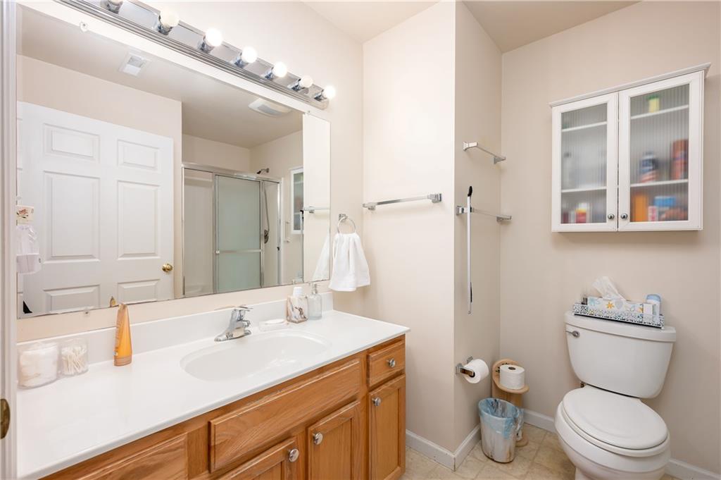 192 Wood Hawk Lane Butler, PA 16001 - Photo 17 of 23 a bathroom with a toilet sink and mirror
