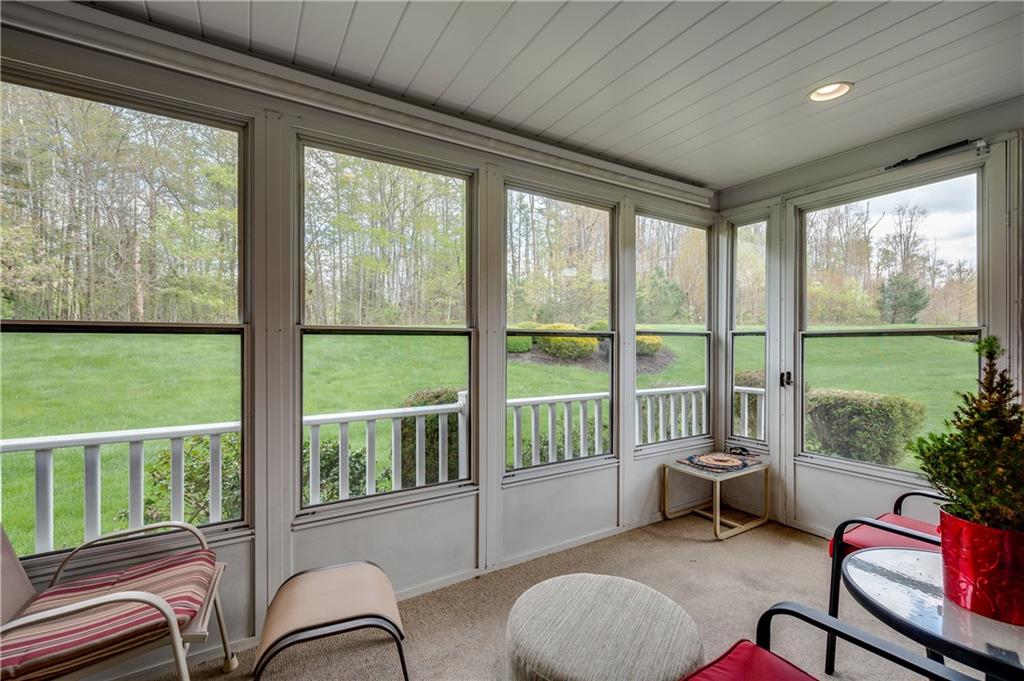 192 Wood Hawk Lane Butler, PA 16001 - Photo 21 of 23 a living room with furniture and a floor to ceiling window