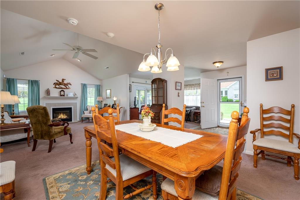192 Wood Hawk Lane Butler, PA 16001 - Photo 5 of 23 a view of a dining room with furniture a chandelier and wooden floor