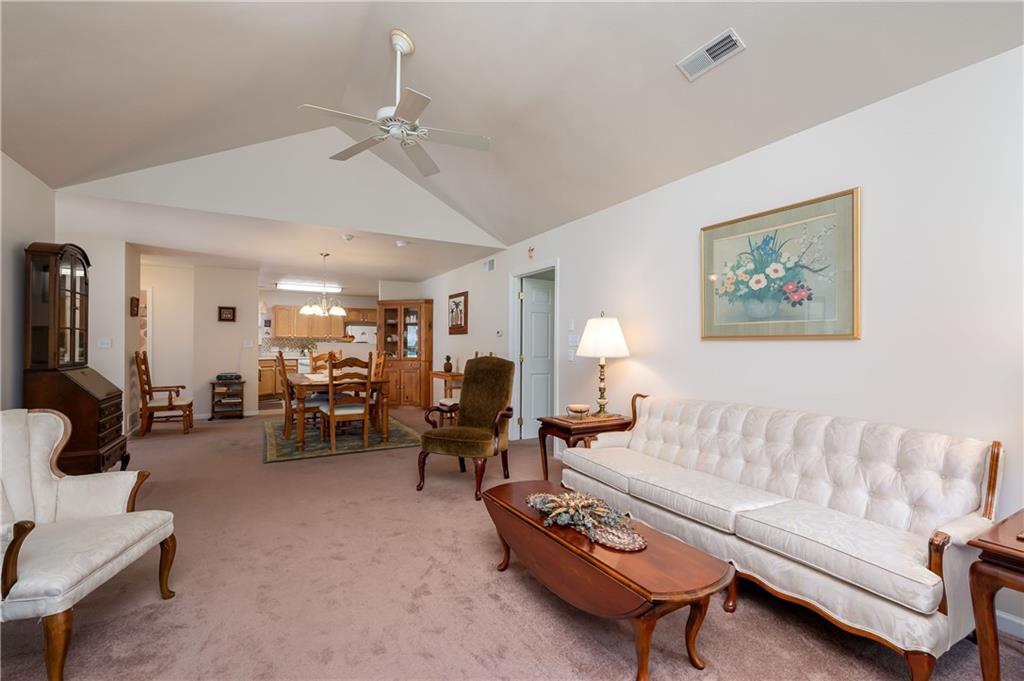 192 Wood Hawk Lane Butler, PA 16001 - Photo 10 of 23 a living room with furniture and a chandelier