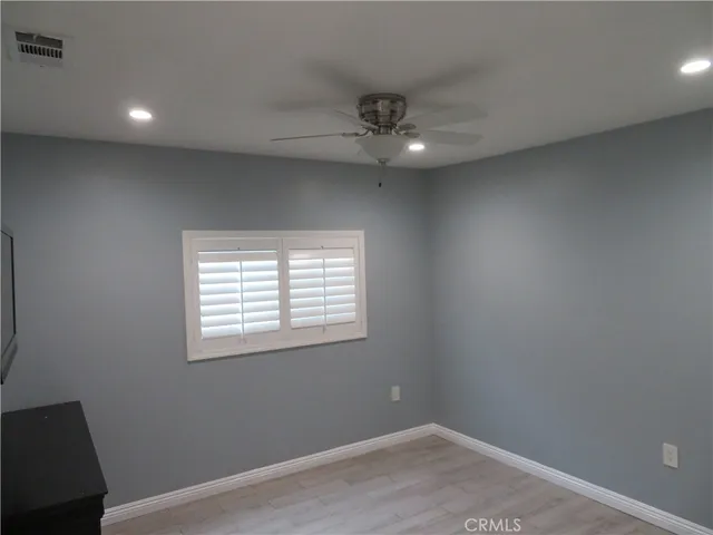 a bathroom with a shower and toilet