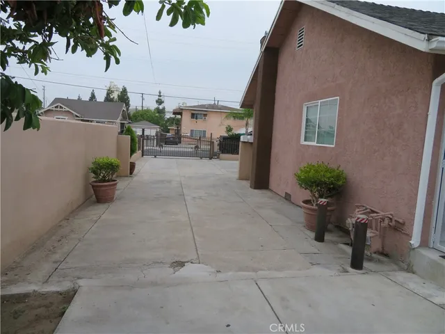 a large kitchen with kitchen island white cabinets and stainless steel appliances