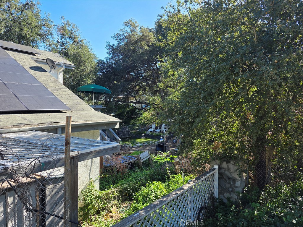 9341 Rollins Road Chatsworth, CA 91311 - Photo 13 of 15 a view of a house with a yard and plants