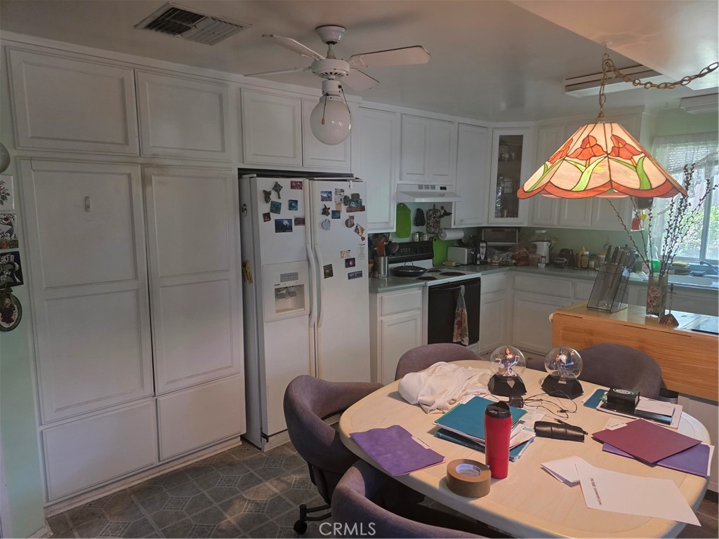 9341 Rollins Road Chatsworth, CA 91311 - Photo 4 of 15 a view of a dining room with furniture and a chandelier