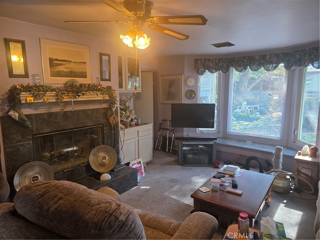 9341 Rollins Road Chatsworth, CA 91311 - Photo 9 of 15 a living room with furniture and a flat screen tv