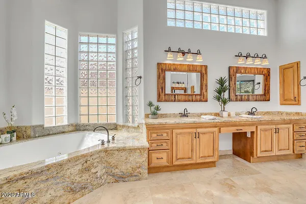 a view of an empty room with cabinet and a bathroom view