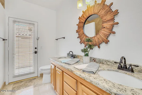 a bathroom with a toilet a sink and a shower