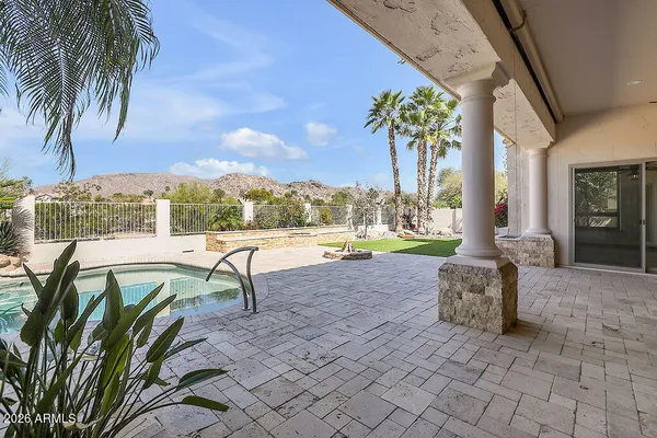 a lobby with furniture and floor to ceiling window