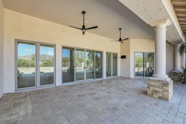 a view of a swimming pool with a patio