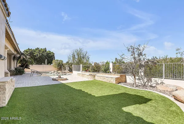 an aerial view of residential houses with outdoor space and river