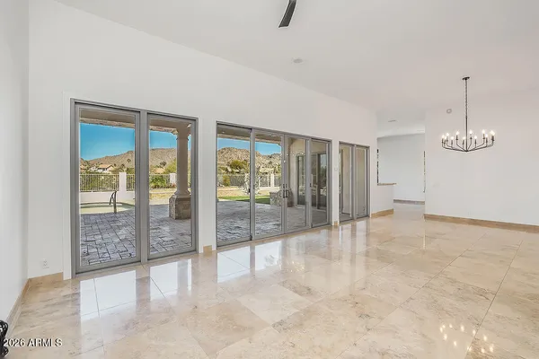 a view of an empty room with glass door