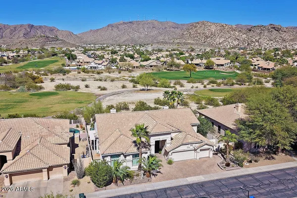 an aerial view of a house with a garden
