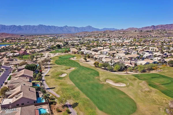 a view of a backyard of the house