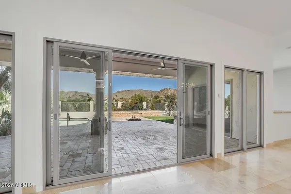 a view of a glass door and a living room