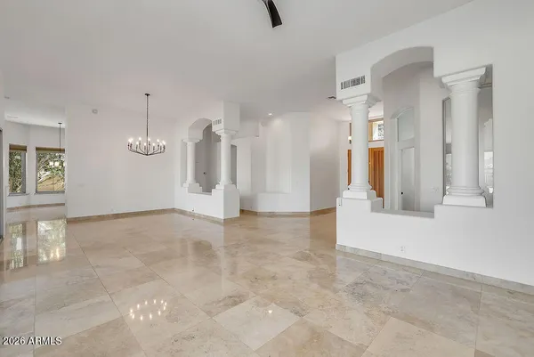 a view of an entryway with a chandelier