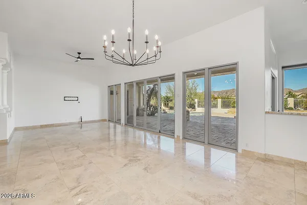 a kitchen with granite countertop a sink and a stove