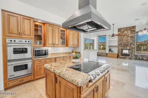 a kitchen with a stove a sink dishwasher and a refrigerator