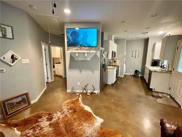 a room with gym equipment and a table
