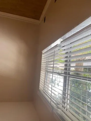 a view of empty room with windows