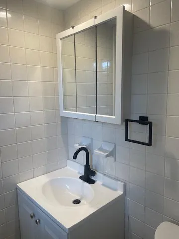 a view of a street with a car parked