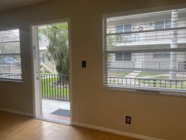 a view of a door and a window