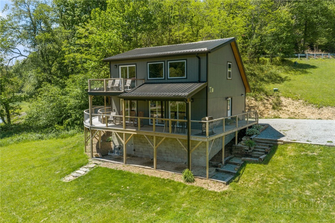 634-636 Watauga River Road Sugar Grove, NC 28679 - Photo 2 of 50 a view of a house with a backyard